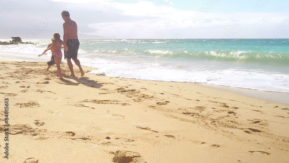 A man places a golf ball on the ground and hits it