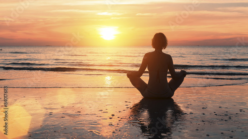 Wallpaper Mural Silhouette of a young yoga woman sitting in the Lotus position Torontodigital.ca