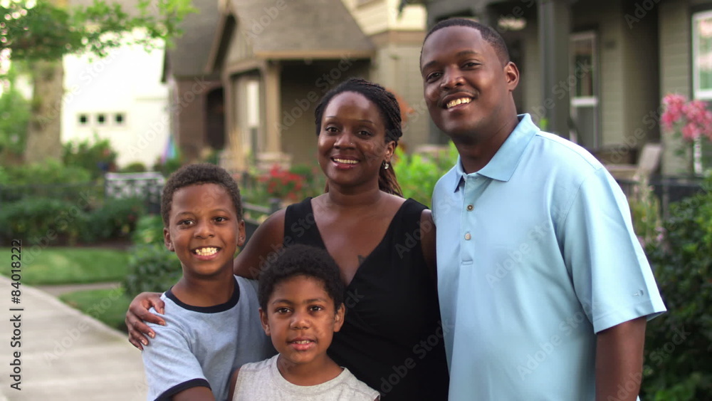 Adorable African American family portrait with mother, father and two boys. Medium shot Adorable African American family portrait with mother, father and two boys. Medium shot
