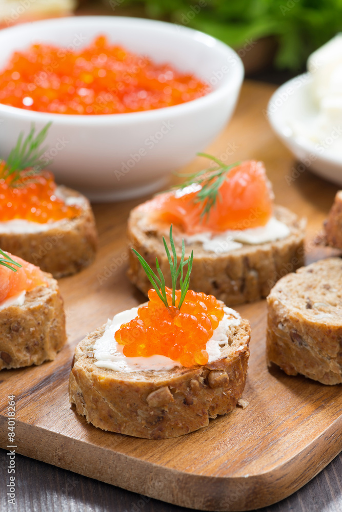 appetizers - toast with salted salmon and red caviar, vertical appetizers - toast with salted salmon and red caviar, vertical