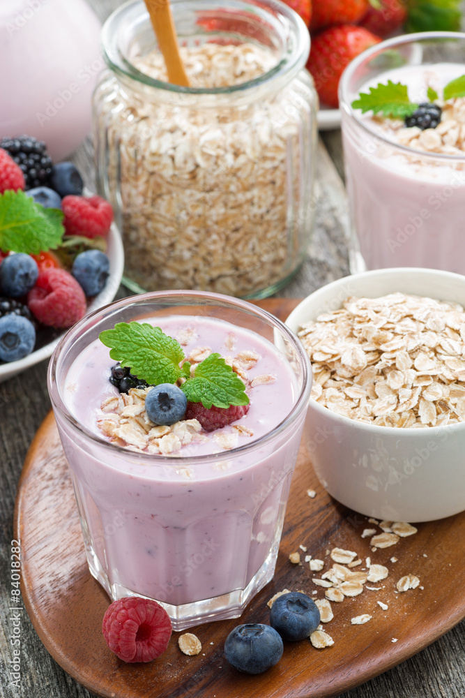 berry smoothie with oatmeal in a glass, vertical berry smoothie with oatmeal in a glass, vertical