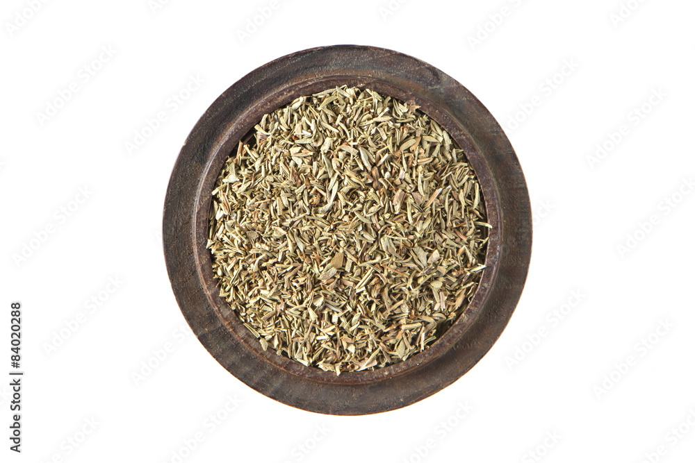 Thyme dried  in wood bowl on isolated white., Top view 