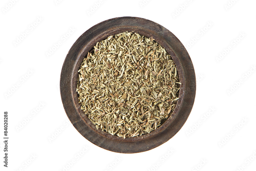 Thyme dried in wood bowl on isolated white., Top view Thyme dried in wood bowl on isolated white., Top view