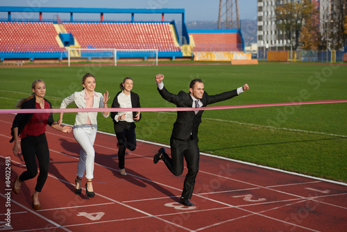 business people running on racing track