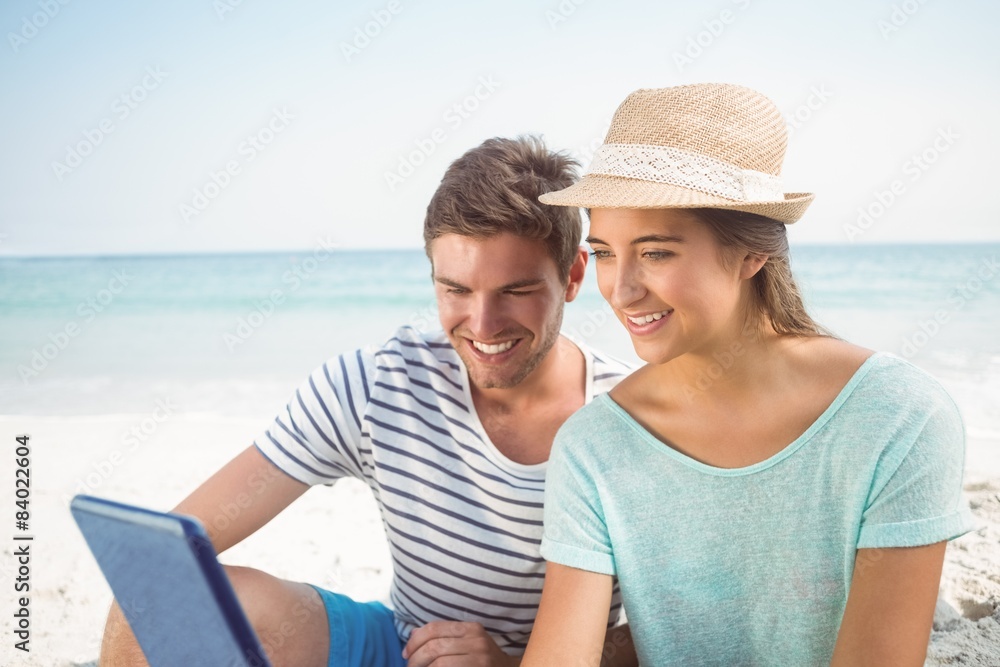 happy couple using tablet computer 