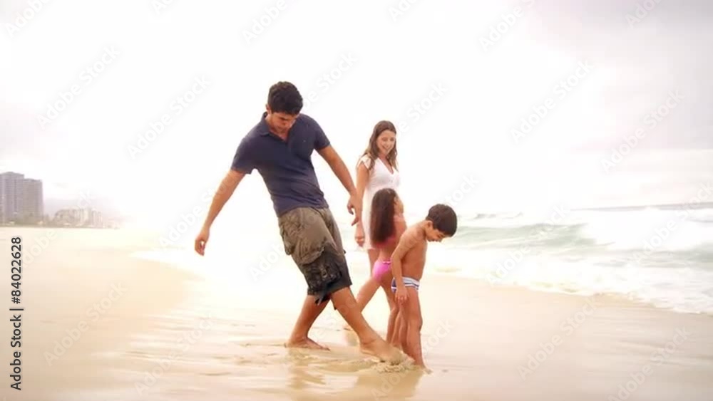 Brazilian Family plays on a beach in Brazil Brazilian Family plays on a beach in Brazil