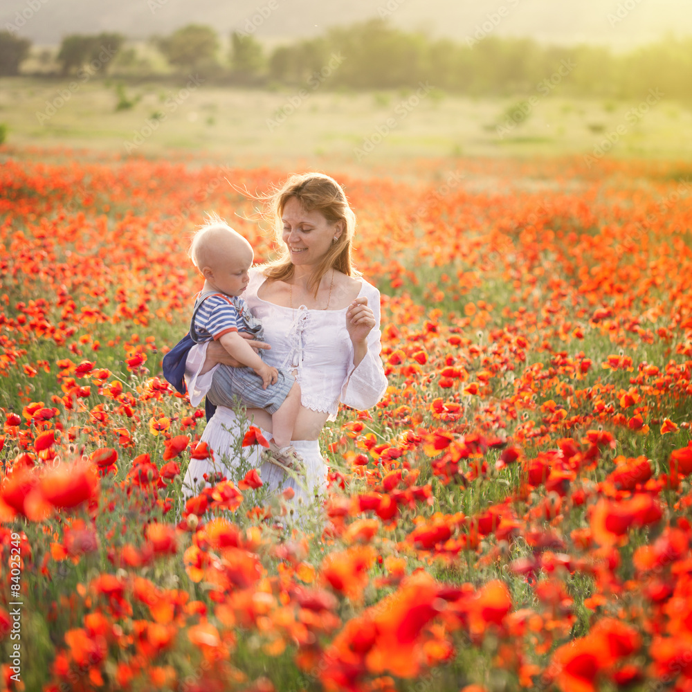 Woman with child in field with poppies Woman with child in field with poppies