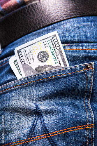 dollars in a jeans pocket, closeup