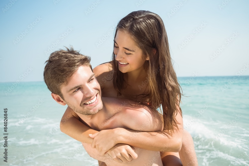 Handsome boys doing piggy-back to his girlfriend Handsome boys doing piggy-back to his girlfriend