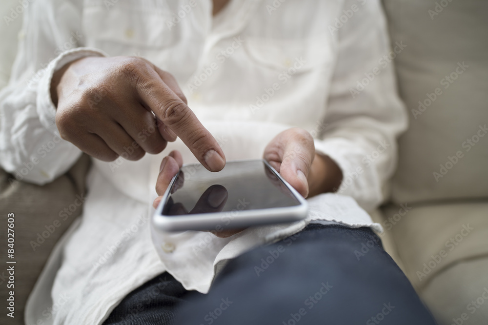 Men are sending mail on a couch at home Men are sending mail on a couch at home