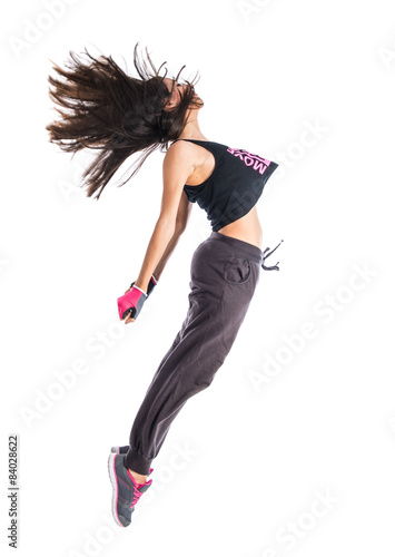 Teenager girl jumping in hip hop style