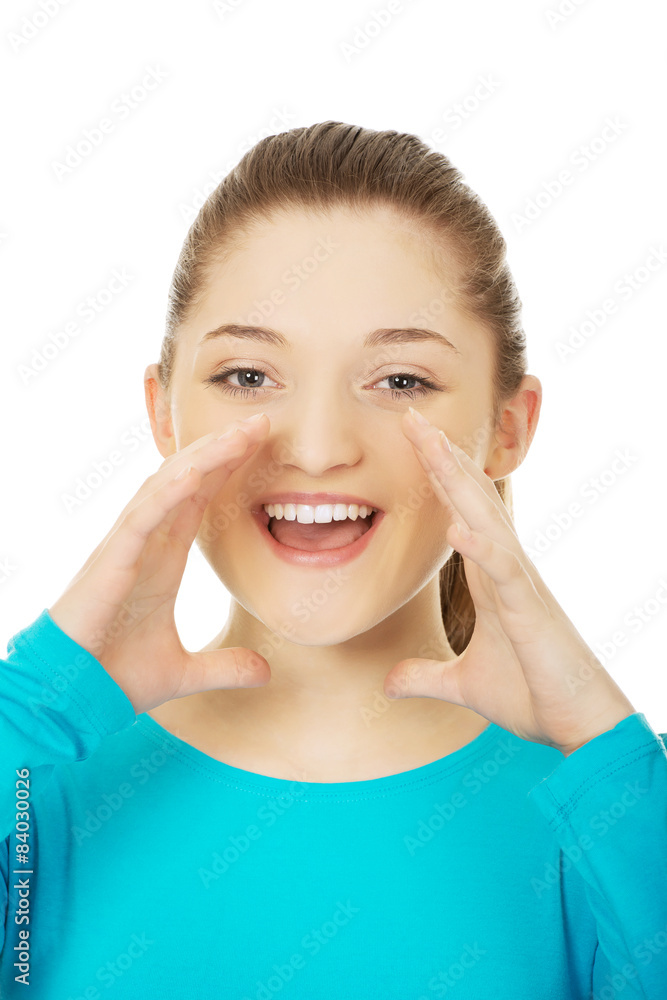 Young woman whispering a gossip. Young woman whispering a gossip.