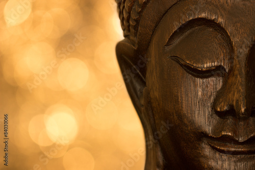 Close Up Buddha on orange/yellow background photo