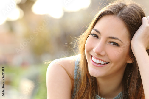 Girl smiling with perfect smile and white teeth photo