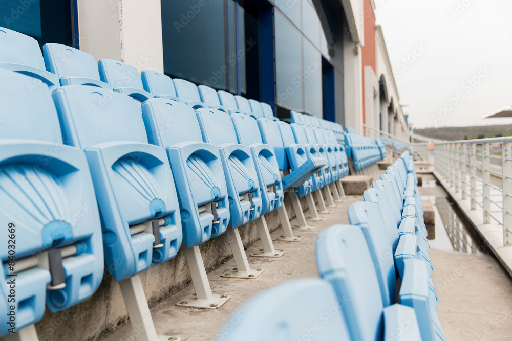 Fototapeta premium rows with folded seats of bleachers on stadium