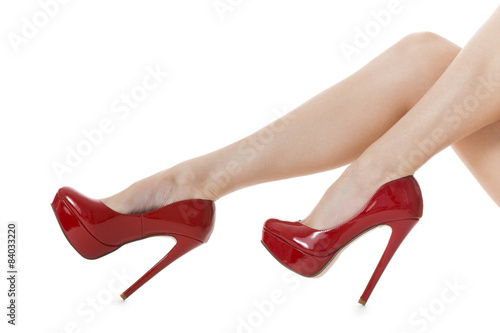attraktive weibliche Beine mit roten Stilettos High Heels als Na