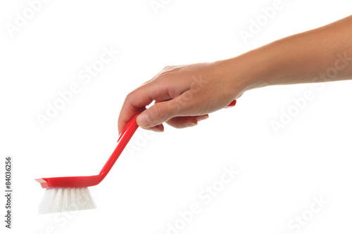 Hand with cleaning brush