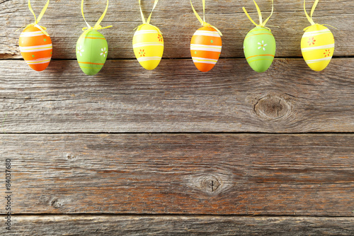 Easter eggs on grey wooden background © 5second