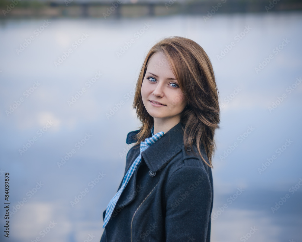 Dramatic portrait of a girl theme: portrait of a beautiful girl on a background of the river Dramatic portrait of a girl theme: portrait of a beautiful girl on a background of the river