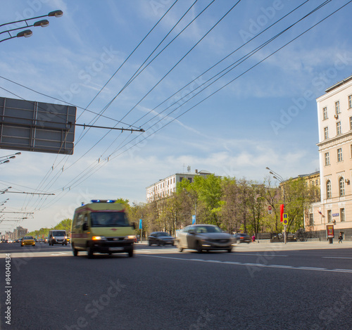 Blurred ambulance racing through the streets of Moscow