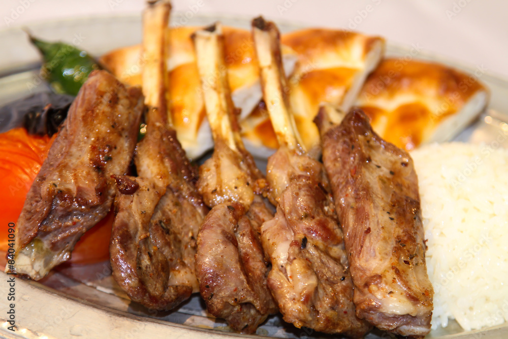 Delilcious lamp chops served in a white plate. Delilcious lamp chops served in a white plate.