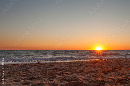 A beautiful sunset on a sandy beach in Kacha.