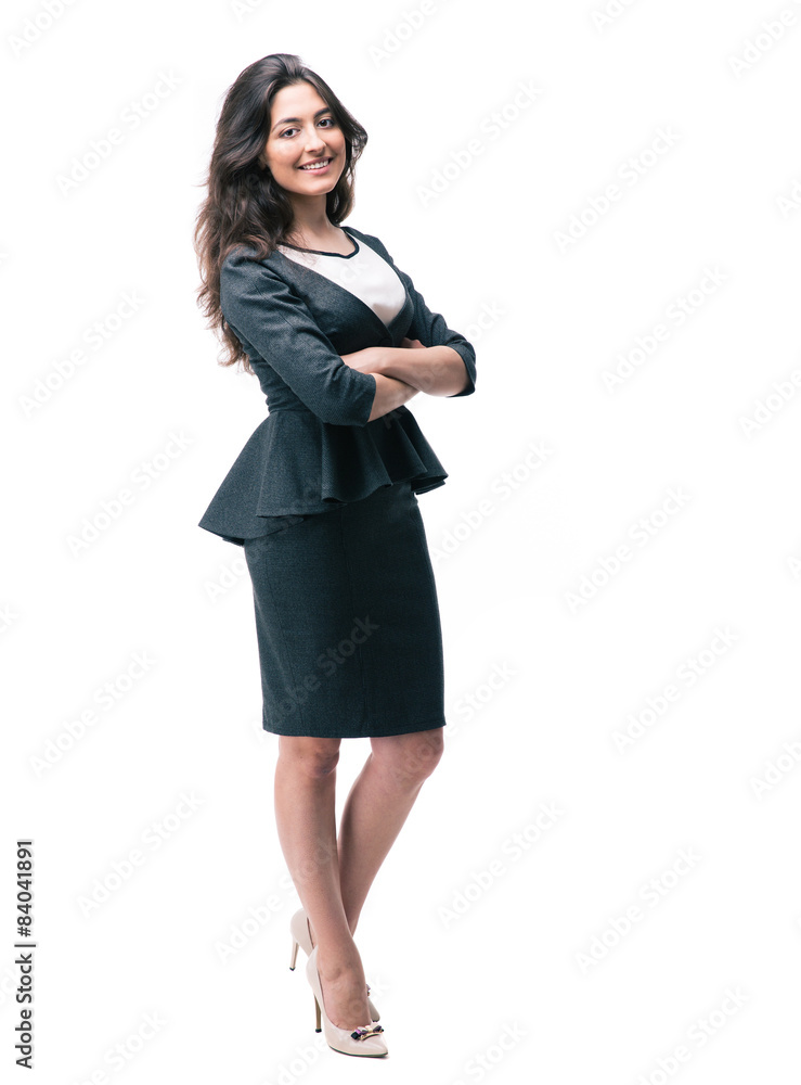 Smiling businesswoman standing with arms folded Smiling businesswoman standing with arms folded