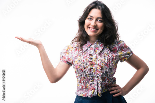 Happy woman presenting copy space on her palm