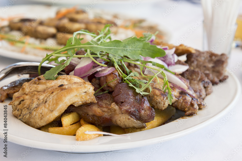 Mixed grilled meat served on restaurant table Mixed grilled meat served on restaurant table