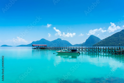 wood jetty and speed boat