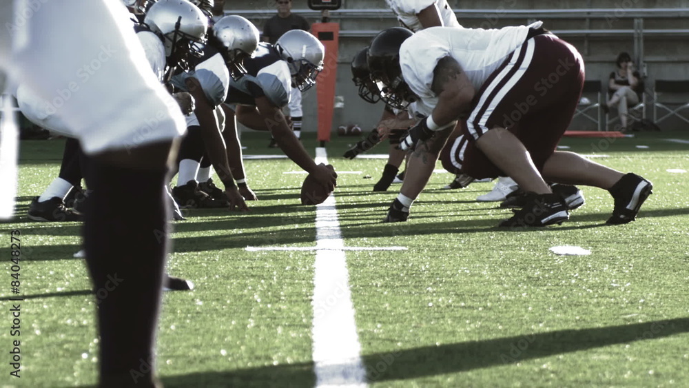 Quarterback snaps the ball and fakes a handoff and runs and throws the