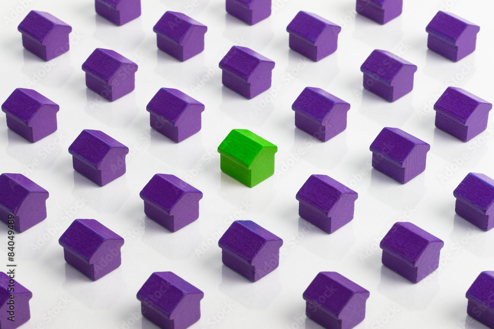 Red house in group of purple houses. Red house in group of purple houses.