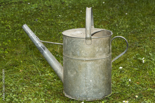Old metal water can for gardening