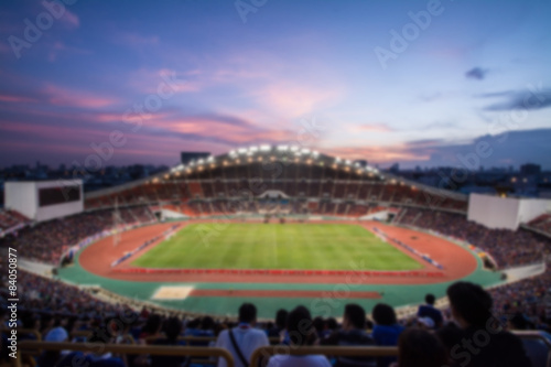 defocused of  soccer or football stadium at twilight,Thailand