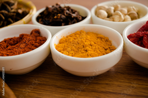 Wooden table of colorful spices