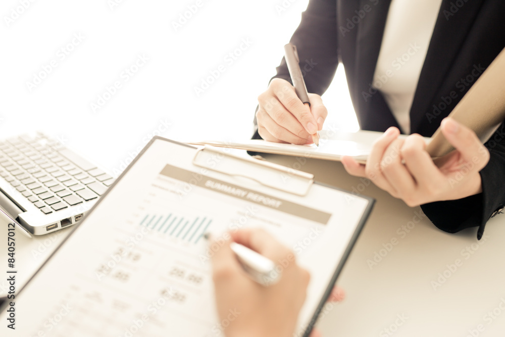 Business people discussing the charts and graphs showing the res Business people discussing the charts and graphs showing the res