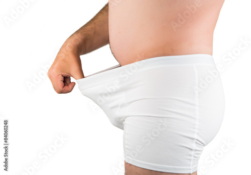 close up of man on white boxer underwear pointing at penis