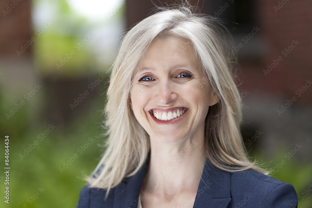 Portrait Of A Businesswoman Smiling At The Camera Portrait Of A Businesswoman Smiling At The Camera