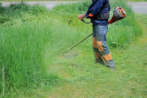 Man mows grass