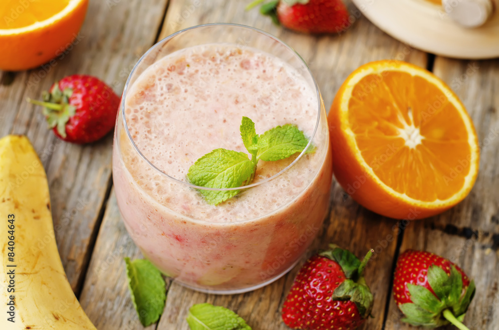 smoothie with strawberries, banana and orange smoothie with strawberries, banana and orange