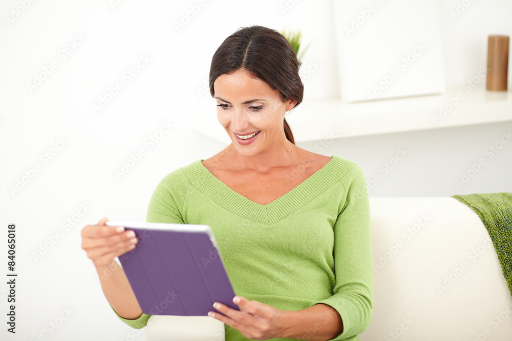Beautiful female looking at a tablet Beautiful female looking at a tablet