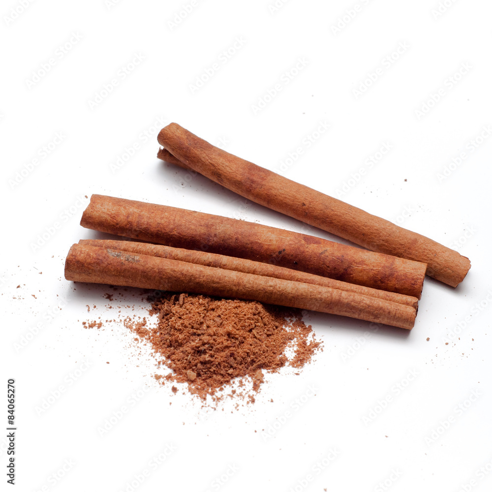 Cinnamon sticks and powder on white background Cinnamon sticks and powder on white background