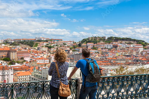 Tourist watching to Lisbon rooftop from Sao Pedro de Alcantara v