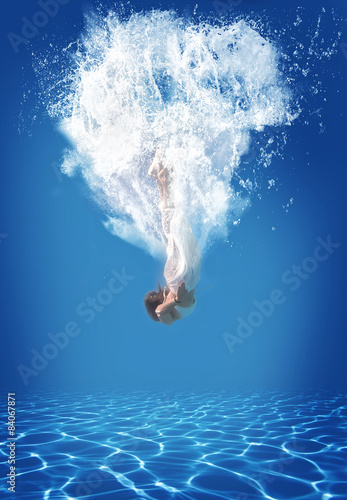 Young woman swimming undewater
