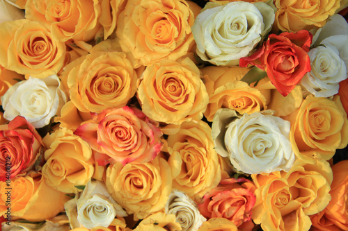 yellow and white rose wedding arrangement