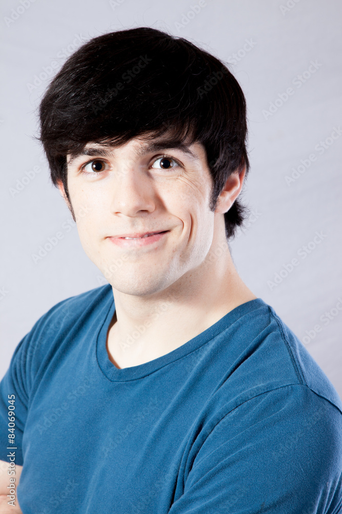 Fototapeta premium Man in blue shirt, smiling with joy