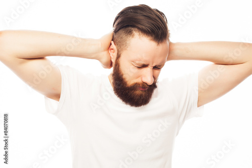 man covering his ears by hands