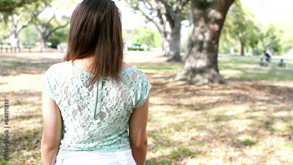 Black woman walks through a park Black woman walks through a park