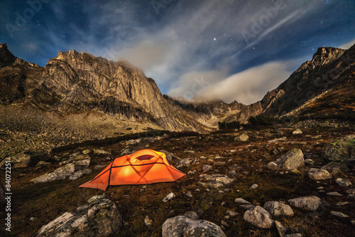 Orange tent in the mountains.
