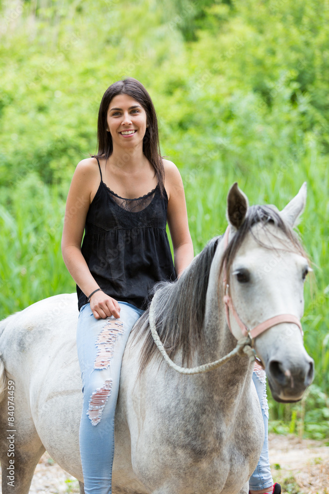Fototapeta premium Young woman with her horse